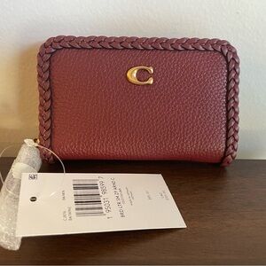 NWT Coach zip around card case with braid.